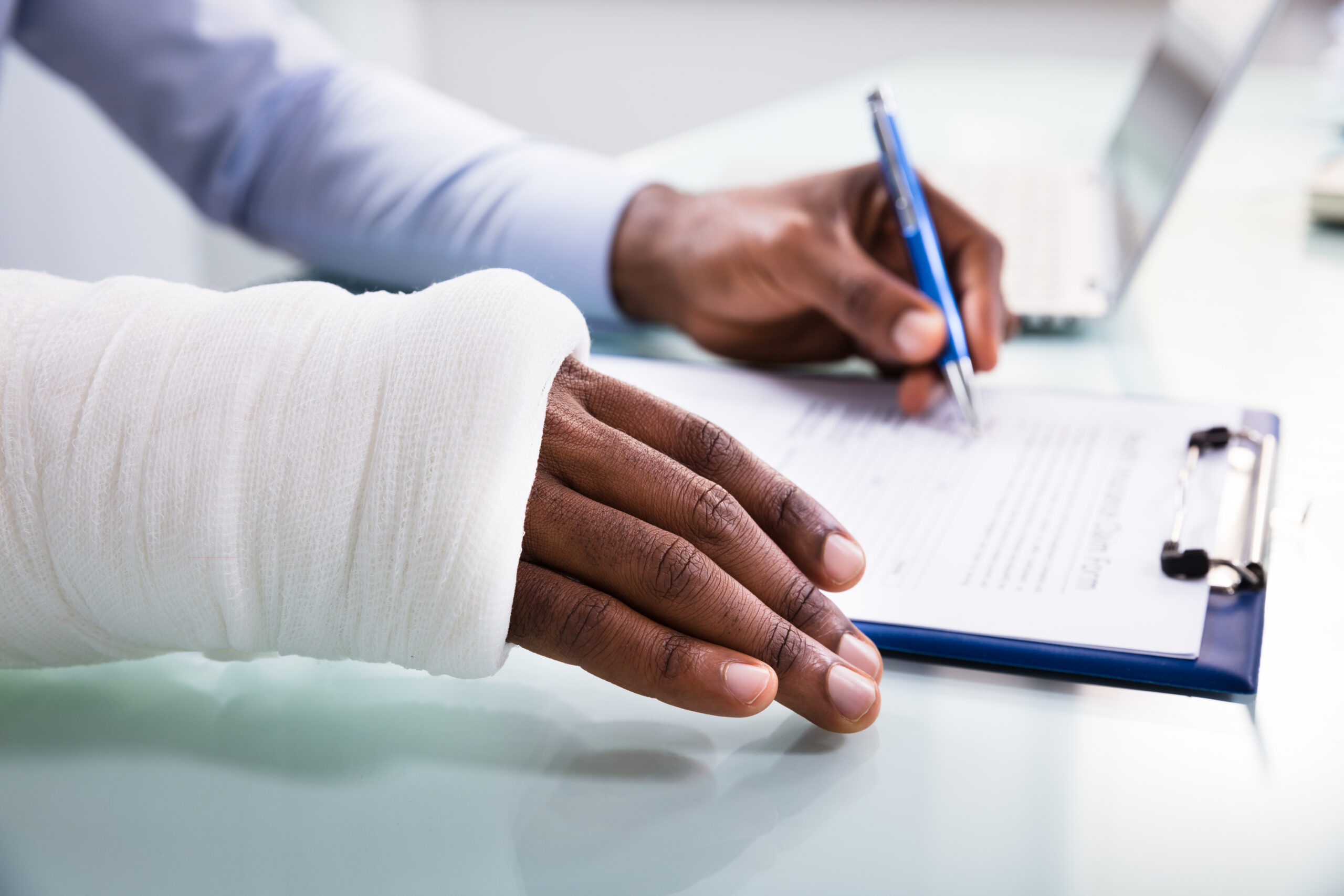 Injured worker reviewing a claim form